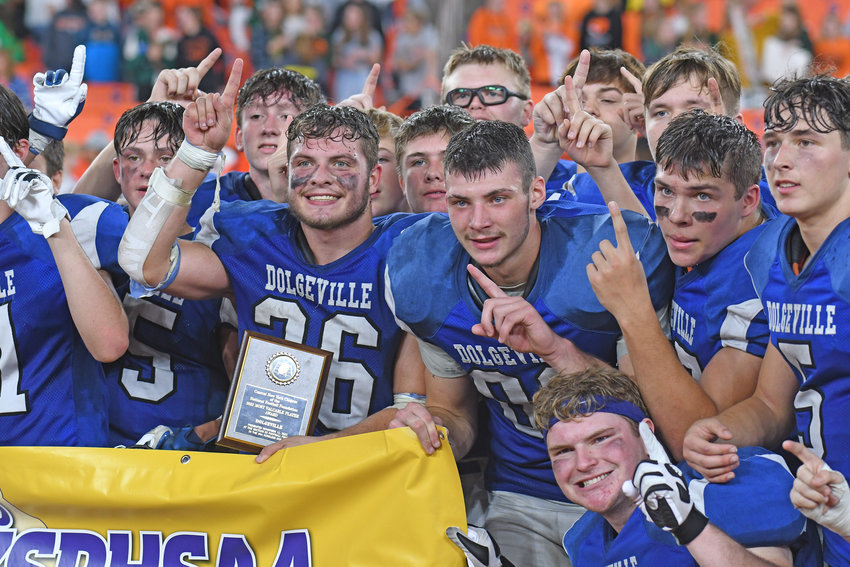 Dolgeville players celebrate their Section III championship Friday afternoon at the JMA Wireless Dome in Syracuse. The Blue Devils defeated Beaver River 44-24. The program has won 19 Section III titles.