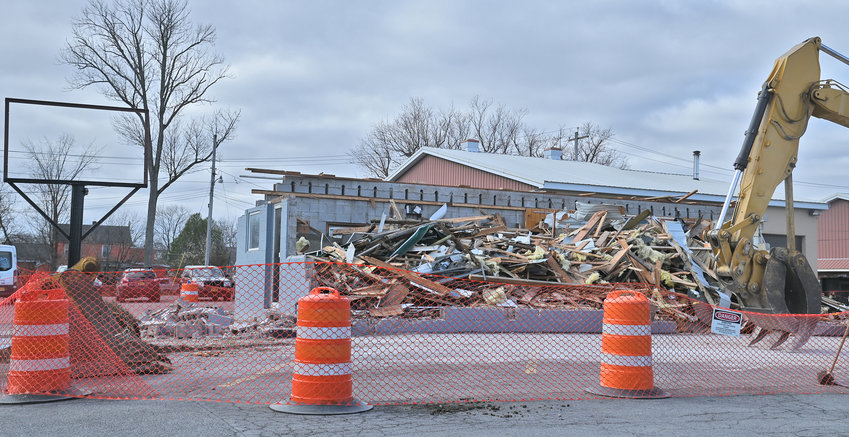 A crew uses heavy equipment to demolish the former CPJ&rsquo;s Restaurant on upper Floyd Avenue in Rome on Monday, Nov. 14. The restaurant has been closed since shortly after the death of its owner earlier this year.