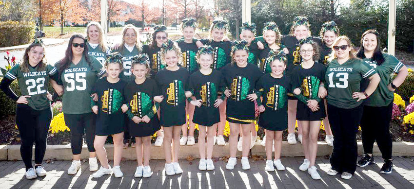 The Adirondack Pop Warner Pee Wee cheerleaders, regional champions going on to compete at nationals in Florida, from left: In front, Maria Rodriguez (coach), Toni Lorentz (coach), Anna Milburn, Gabriella Perry, Adrianna Call, Lauren Curry, Kenna Reese, Nevaeh Race, Emily Maricle, and Jamilee Maricle (coach). In back, Crystal Staring (coach), Cindy Kerber (coach), Faith Perry, Kaylee Pond, Kaya Moseby, Elyzabeth Narbone, Brooke James, Kilee Maine, Ella Clementi, and Alicia Clementi (coach).