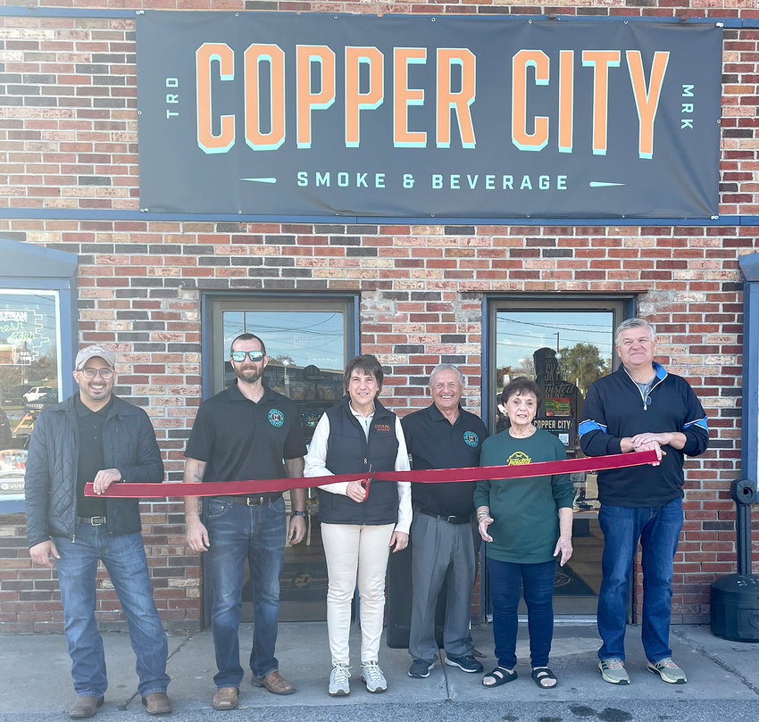 Copper City Smoke &amp; Beverage, 218 S. James St., Rome, celebrated its grand opening with a ribbon cutting and open house on Saturday, Oct. 29. From left: Michael J. Luiere, co-owner; Anthony Varano, co-owner; Mayor Jacqueline M. Izzo; Rocco Luiere, co-owner; Fourth Ward Councilor Ramona L. Smith; and Duane Latham. Copper City Smoke &amp; Beverage has a 1,800 square-foot, walk-in store with a unique variety of beers from local and out-of-state microbreweries, as well as larger beer companies, in addition to ciders and seltzers. There is also a wide selection of traditional and alternative smoking products, as well as potato chips and other snacks.