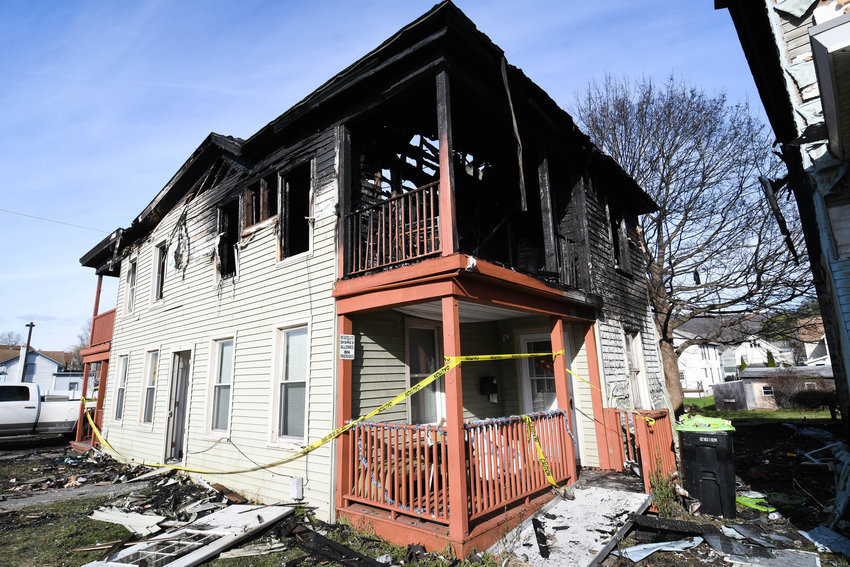 One of two homes heavily damaged by fire on East Clark Street in Ilion Monday evening. A total of 13 people &mdash;&nbsp;nine adults and four children &mdash;&nbsp;have been displaced from their homes. Fire officials said no one was injured.