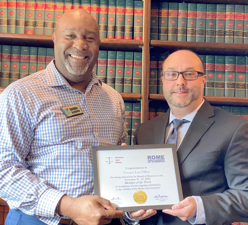 Pictured left to right: Bruce Hairston, member of the Chamber&rsquo;s Membership Committee, presenting the congratulatory certificate to Meade H. Versace, Esq.