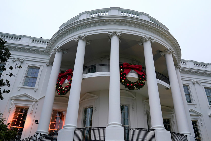 Wreaths hang on the Truman Balcony of the White House in Washington, Sunday, Nov. 27, 2022.
