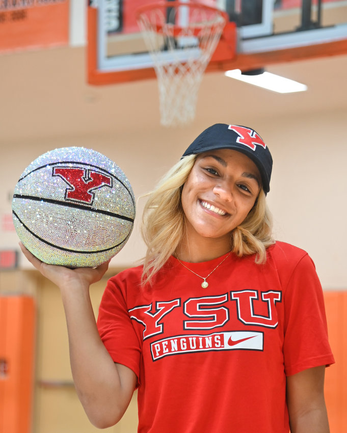 Amya McLeod poses at the Rome Free Academy basketball court after signing her National Letter of Intent on Nov. 10 to play Division I college basketball at Youngstown State in Ohio. The senior is closing in on second in all-time scoring for the Black Knights and is among the leaders in virtually every offensive and defensive career statistic in program history.