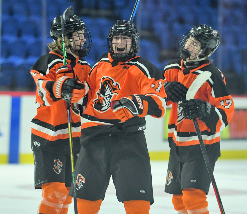 RFA&rsquo;s Jacob Swavely (middle) celebrates his first period goal with teammates Logan Waterman, left, and Jimmy DeAngelo, right on Thursday night at the Adirondack Bank Center in Utica. RFA picked up a 5-1 win over Mohawk Valley.
