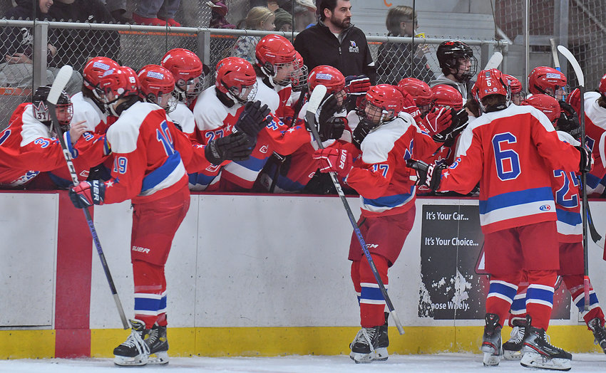 The New Hartford team celebrates their first period goal Friday night at Kennedy Arena. New Hartford and RFA tied 2-2 in the standings, though New Hartford advanced to the tournament final with a shootout win.