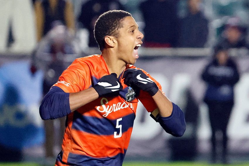 Syracuse's Amferny Sinclair celebrates after scoring a penalty kick against Indiana to win the NCAA College Cup championship against Indiana on Monday in Cary, N.C.
