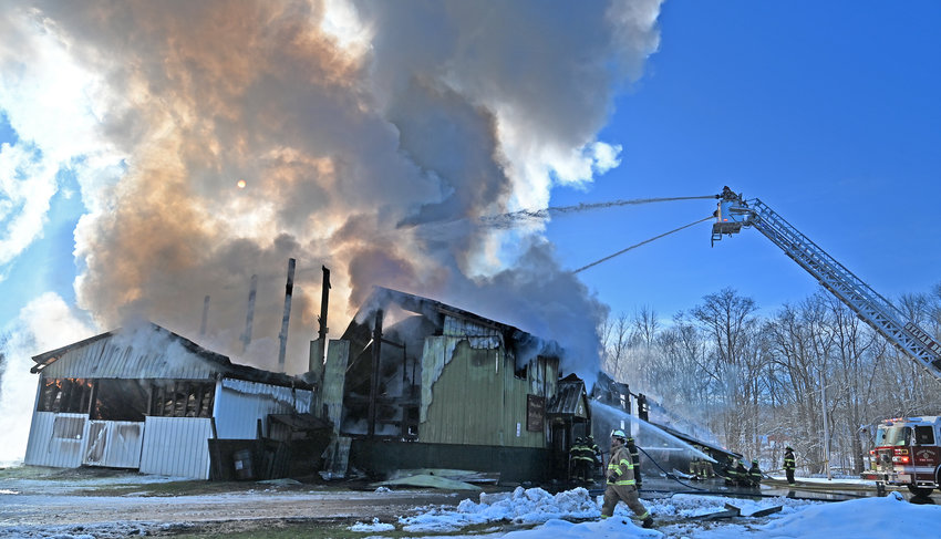 Area firefighters work the Village of Camden Department of Public Works building fire that was a total loss Tuesday, December 13, 2022, just as a winter storm is headed to the area.