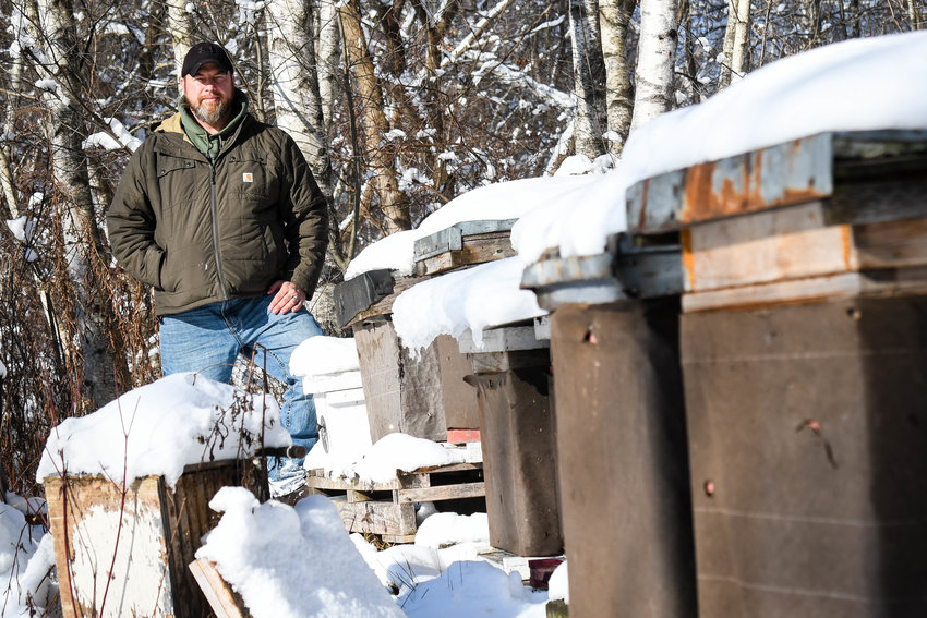 Jimmy Morawiec stands outside with his bee hive crates on Wednesday, Dec. 21 in Marcy. Morwiec teaches beginner and advanced beekeeping classes at Cornell Cooperative Extension and has been keeping bees in Oneida County for 16 years.