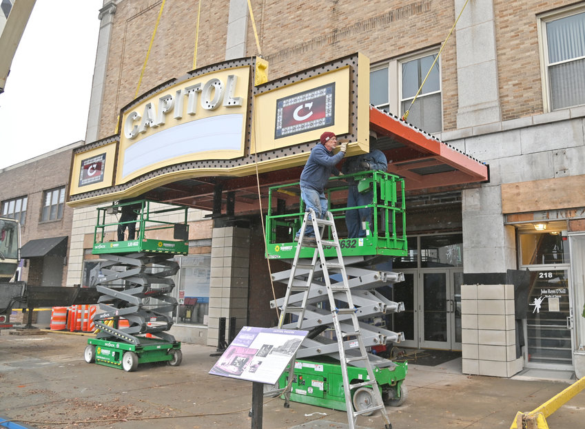 Installation of the new re-created marquee is installed by Wagner Electric Signs at Capitol Theatre. The &quot;blade&quot; &mdash; 45 1/2 foot sign &mdash; was installed last year and part of the 1928 theater's $2.5 million restoration project. Capitol Arts Complex is undergoing a campaign to raise funds for further restoration work and increased programming.