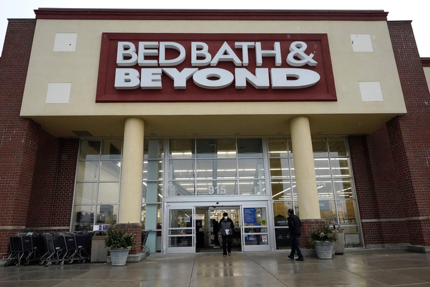 Shoppers enter and exit a Bed Bath &amp; Beyond in Schaumburg, Ill., Jan. 14, 2021. Struggling Bed Bath &amp; Beyond warned on Thursday that there's substantial doubt about the company's ability to continue as a &quot;going concern&quot; even as it continues to look at options like refinancing its debt or restructuring its business in bankruptcy court.