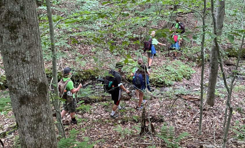 Campers in the state Department of Environmental Conservations Summer Camp program take a hike in the wilderness in this program file photo. Families are encouraged to sign up early for the 2023 DEC Summer Camp Program, officials said, as limited spaces are available for the popular program at the DEC&rsquo;s four residential camps.