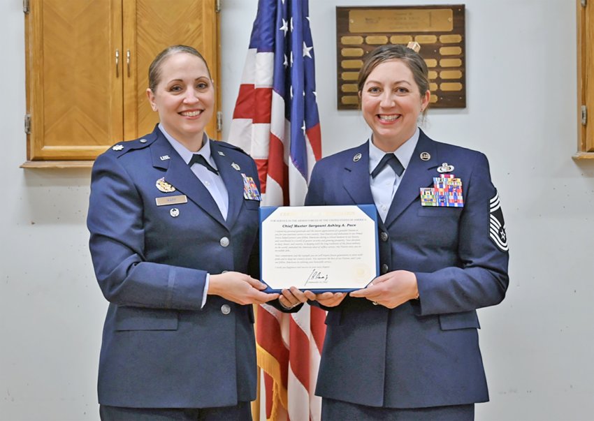 New York Air National Guard Chief Master Sgt. Ashley A. Pace (right) receives a Certificate of Appreciation from Lt. Col. Jennifer Mapp, during a retirement ceremony held at Hancock Field Air National Guard Base, Syracuse, New York. (U.S. Air National Guard photo by Staff Sgt. Duane Morgan)