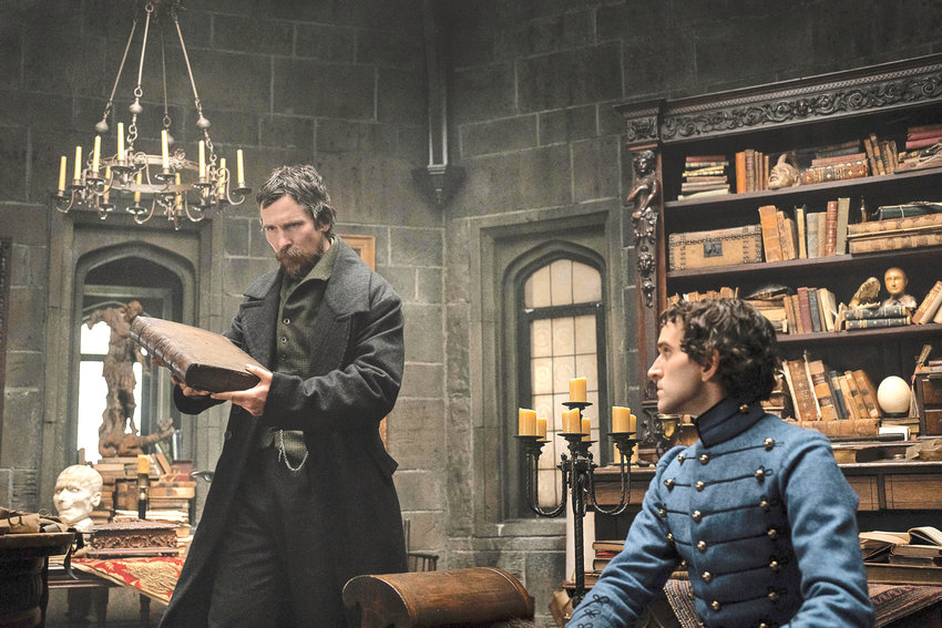 Christian Bale as Augustus Landor, left, and Harry Melling as Edgar Allan Poe in a scene from &ldquo;The Pale Blue Eye.&rdquo;