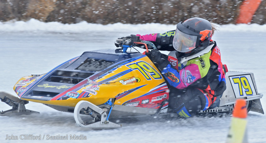 Sabrina Blanchet from Drummondville, Canada hugs the low groove going through the first turn during the 340 Liquid mod final Sunday afternoon at Boonville Fairgrounds. Blanchet won the final and also the Super Mod 440 Adirondack Cup.