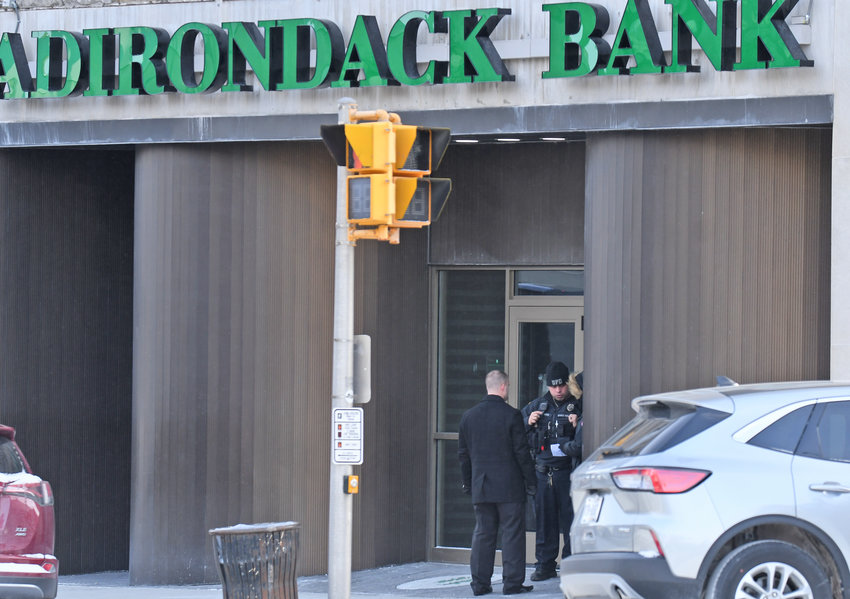 Several police officers were stationed in front of Adirondack Bank at 185 Genesee St. in Utica on  Friday, Feb. 3, as part of a large response of officers who were dispatched following a call of a possible robbery at the bank at 9:33 a.m. The police have arrested Joseph Thompson on Saturday, Feb. 4, in connection with the robbery.