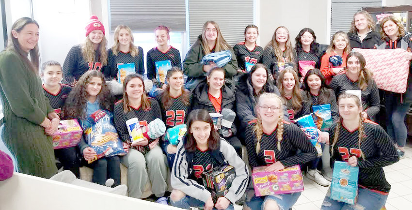 The Remsen Central School JV and varsity volleyball teams delivering their donations to the Anita&rsquo;s Stevens Swan Humane Society.