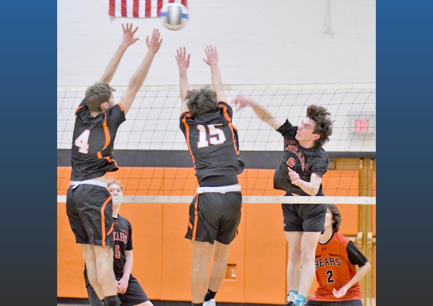 Chittenango&rsquo;s Trevor Cole, right, goes for the kill with Rome Free Academy&rsquo;s Gavin Civitelli, left, and Lucas Yanik defending at Buddy Evans Gym at Strough Middle School in Rome on Thursday. Cole had 15 kills in the Bears&rsquo; three set win.