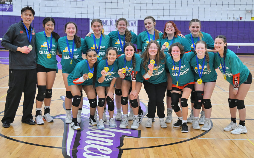 The Rome Free Academy girls volleyball team celebrates with their medals after they defeated Whitesboro in the Section III Class A final on Saturday afternoon at Case Middle School in Watertown. The fourth-seeded Black Knights won their first sectional title 3-1 over the third-seeded Warriors.