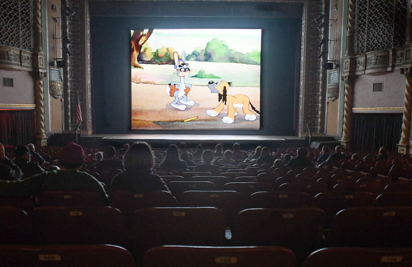 A nearly full house enjoys cartoons at the Capitol Theater in Rome on Monday afternoon.