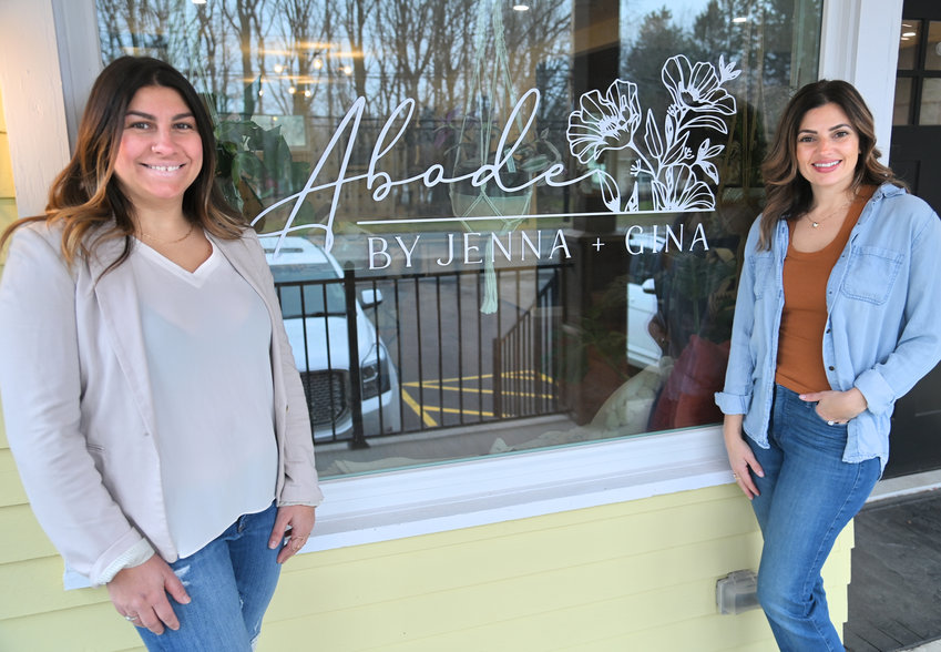 Jenna Rossi (left) and Gina Sangiacomo with their front window signage at Abode on Oxford Road in New Hartford.