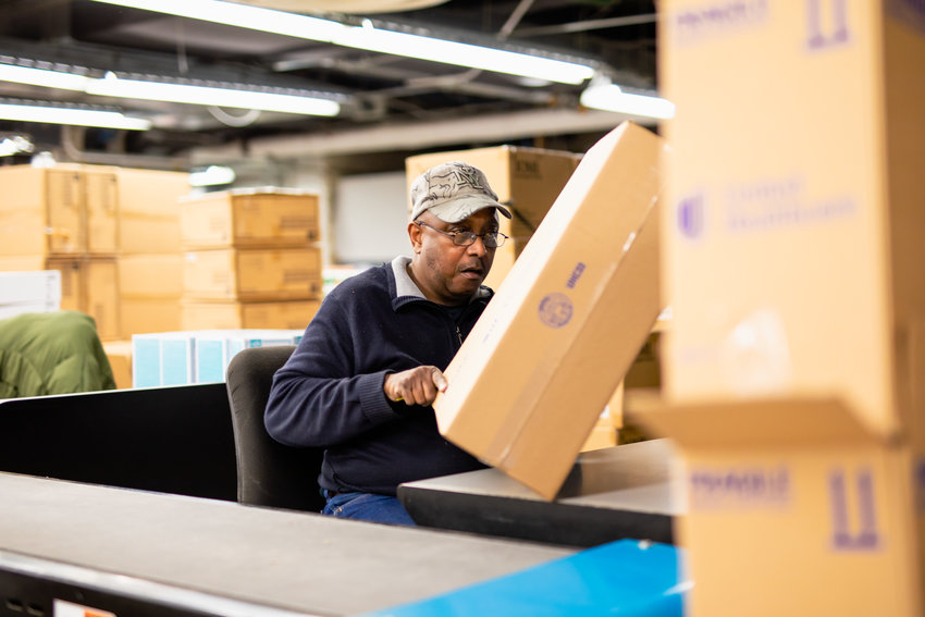 A CABVI employee packages a home health kit. A total of 38,901 home health kits were built in just 10 business days by a team from CABVI&rsquo;s Central Industries.