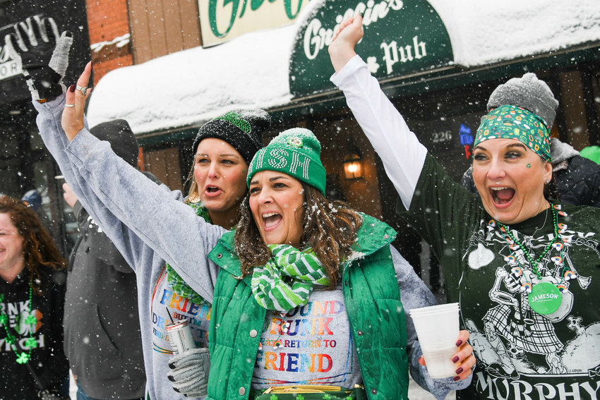 Parade watchers celebrate St. Patrick&rsquo;s Day in March 2022 along Genesee Street in Utica. The Utica St. Patrick&rsquo;s Day Parade returns at 10 a.m. March 11, starting at Oneida Square.