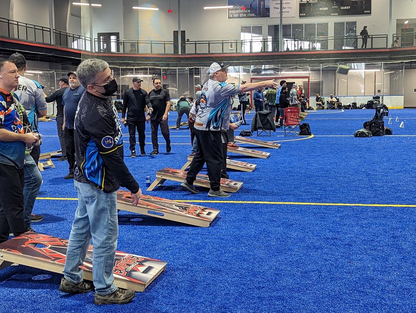Rows of cornholers let the bags fly at the March Regional Tournament for the American Cornhole League on Saturday. The event was held at the Utica University Nexus Center and saw more than 100 competitors and spectators.
