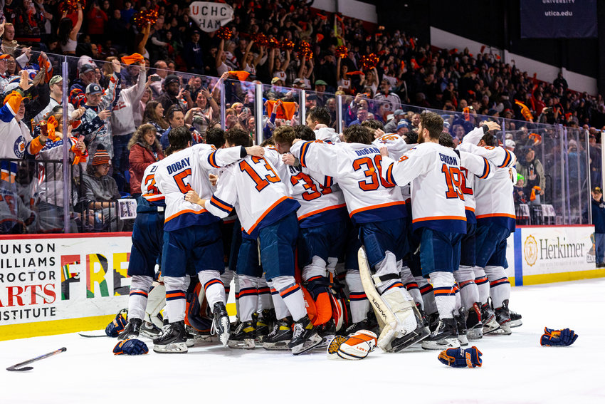 The Utica University men's hockey team celebrates after winning the United Collegiate Hockey Conference title on Saturday in Utica. It is the second time in as many seasons the team has won the title. Utica also earns an automatic bid to the NCAA Division III tournament with the win.