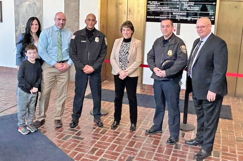 Two new members of the Rome Police Department were sworn in at City Hall on Friday. From left, full-time Patrolman Michael Uhl and his family; Police Chief David J. Collins, Mayor Jacqueline M. Izzo, Deputy Police Chief Cheywnne D. Schoff, and new part-time Patrolman Brian Warcup.