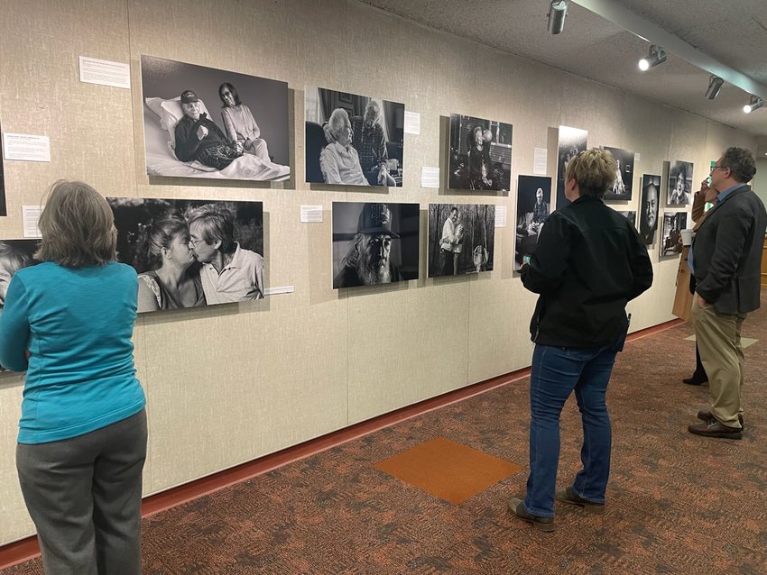 Visitors view &ldquo;The Last Portrait: Reflections of the End of Life&rdquo; by Mark DiOrio, on display now through April 11 at Donald G. Butcher Library at SUNY Morrisville. Portraits are of Hospice &amp; Palliative Care patients from 2014-21.