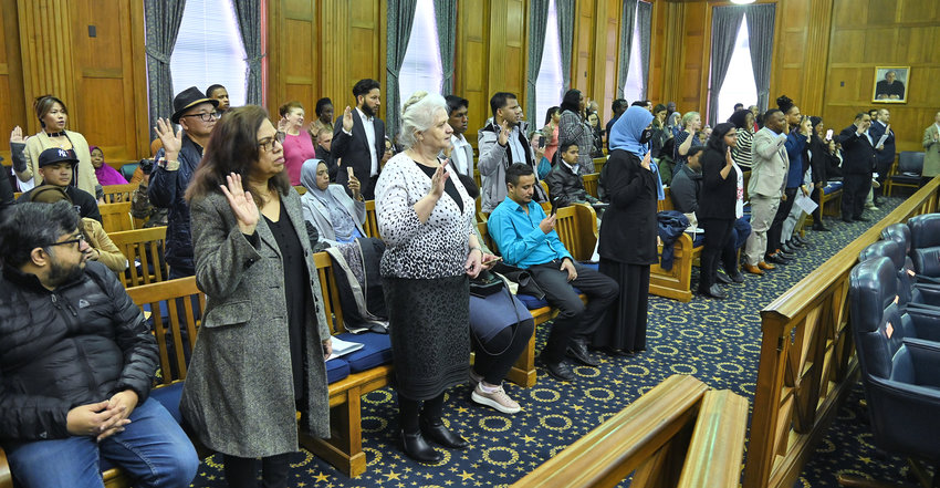 Fifty new citizens take the oath of citizenship Thursday, March 9, at the Alexander Pirnie Federal Courthouse in Utica.