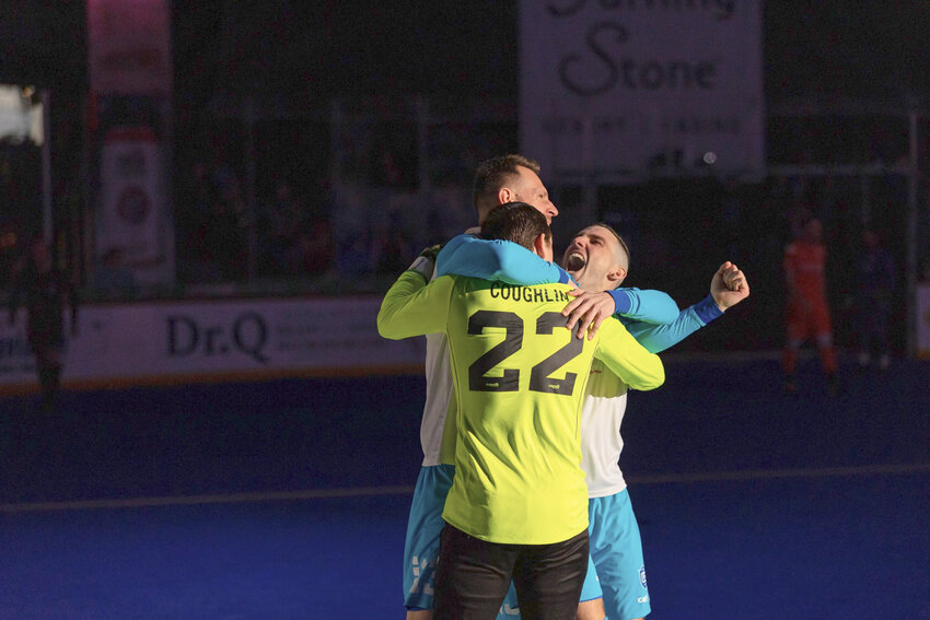 Utica City FC goalkeeper Andrew Coughlin, co-captain Bo Jelovac and Gordy Gurson celebrate during Sunday&rsquo;s game at the Adirondack Bank Center. Gurson scored on a penalty kick with 3:06 left in overtime to help Utica score a 5-4 win over the Florida Tropics.