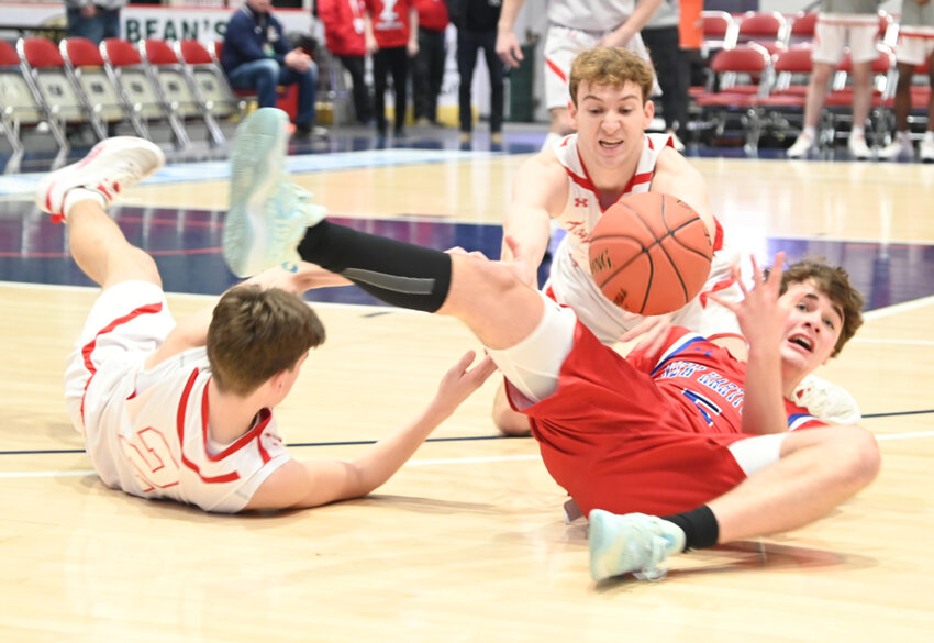 New Hartford's Sam Beaton tries to gain control of a loose ball against Tappan Zee in the state Class A semifinal on Friday at Cool Insuring Arena in Glens Falls. Tappan Zee's defense caused trouble for New Hartford, which was limited to its fewest points all season in a 58-48 loss.