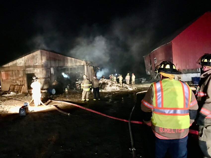 Firefighters from multiple districts work Saturday, March 18 to extinguish a pole barn fire on Route 26 in Vernon.