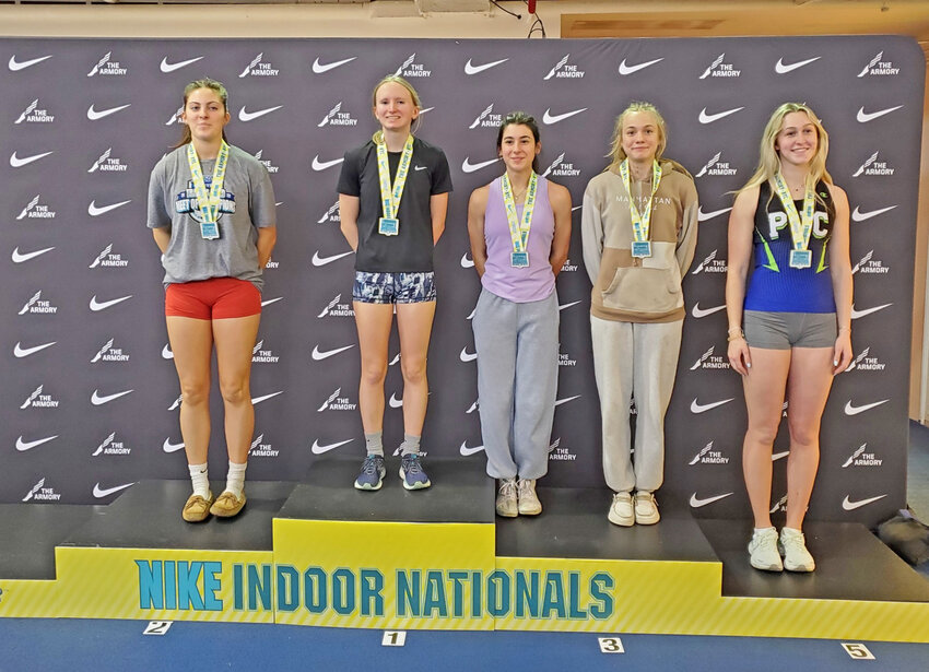 Herkimer Central School senior Melia Couchman, second from left, stands on the medal stand after winning the championship in the girls pole vault emerging elite category at the Nike Indoor Nationals.