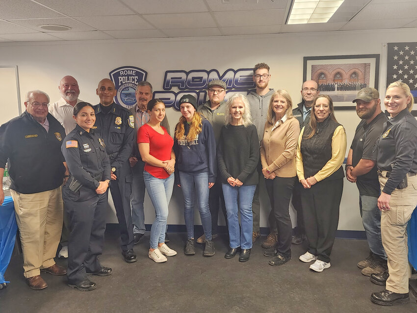 The 12 graduates of the Rome Police Department&rsquo;s Citizens&rsquo; Police Academy pose with members of the department at the Justice Building Wednesday evening.