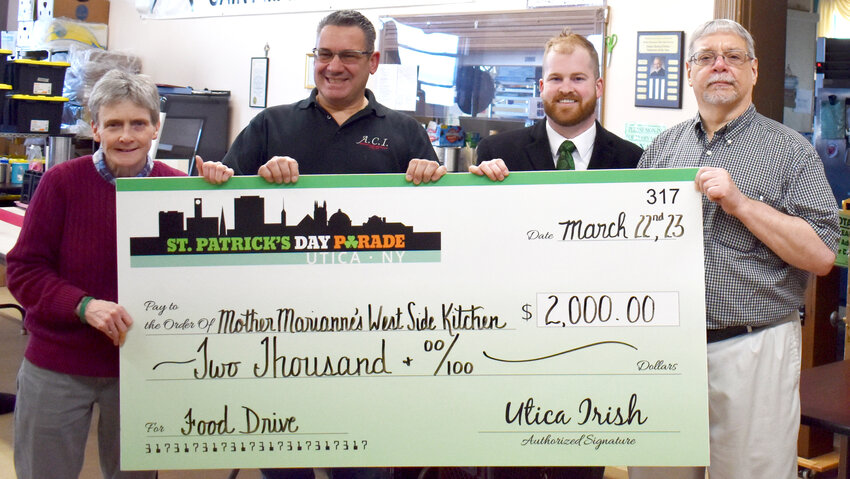 About 950 food items and $2,000 were collected at this year&rsquo;s St. Patrick&rsquo;s Day Parade in Utica and donated to Mother Marianne&rsquo;s West Side Kitchen. Pictured above, from left: Chris Hoke and Bernie Adorino, co-organizers of the parade Food Drive, Patrick McGrath, co-director of the St. Patrick&rsquo;s Day Parade Committee, and Mike Pilat, director of Mother Marianne&rsquo;s West Side Kitchen.