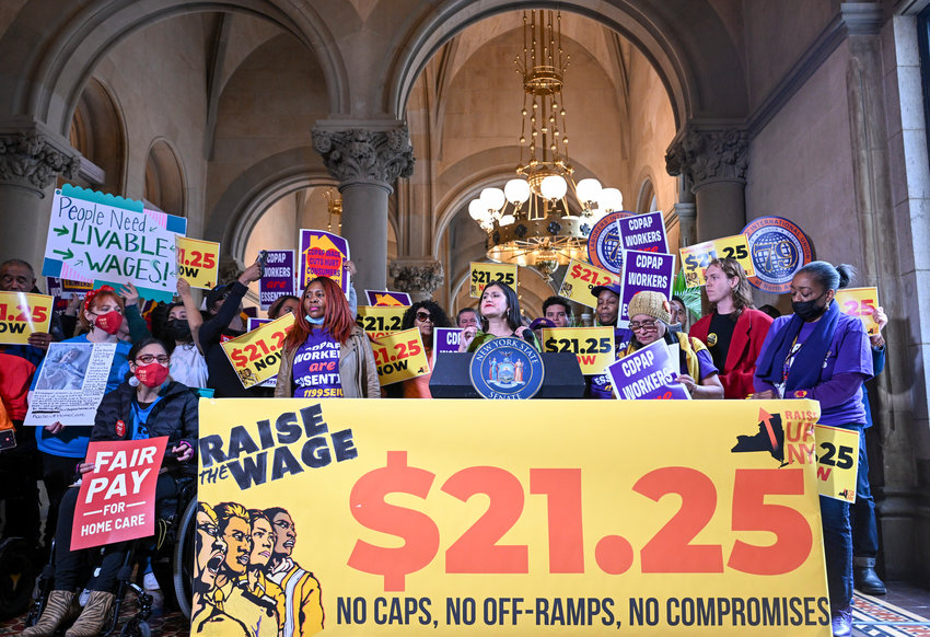 New York Sen. Jessica Ramos, D-East Elmhurst, stands with protesters urging lawmakers to raise New York's minimum wage during a rally at the state Capitol, Monday, March 13, 2023, in Albany, N.Y.