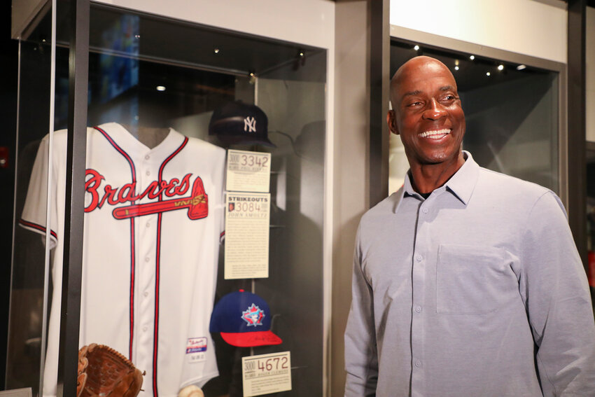 Fred McGriff takes a look at a jersey worn by his former Braves teammate John Smoltz. McGriff visited the National Baseball Hall of Fame on Tuesday for his orientation tour.