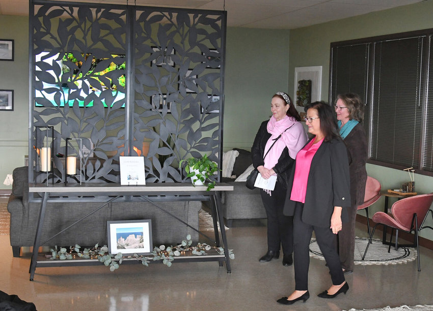 Herkimer College unveiled its new student wellness space, The Zen Den, at a ribbon-cutting ceremony on Tuesday, March 28. &nbsp;From left: Dianne Stancato, CEO, YWCA of Mohawk Valley; Isabella Crandall, chairperson, board of trustees; and Cathleen McColgin, president of Herkimer College, look over some of the elements of the new wellness space for students.
