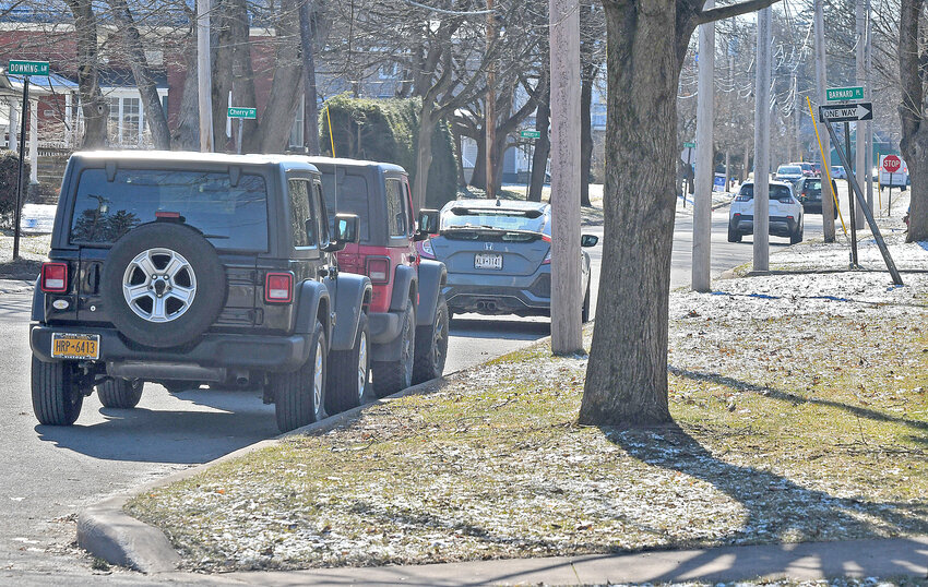 Multiple vehicles are already parked along Elm Street in Rome, just around the corner of North Madison Street. The city&rsquo;s ban on overnight parking will be lifted on Saturday.