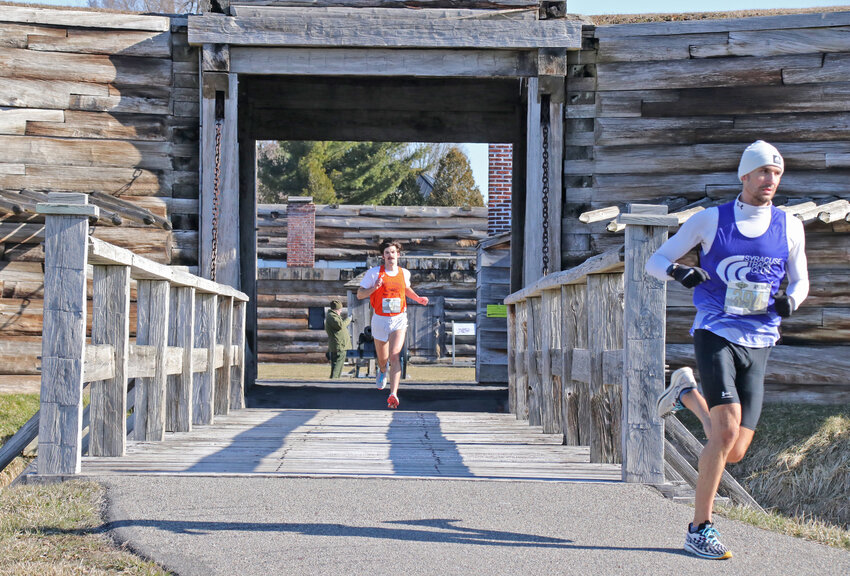 The 35th annual Fort to Fort run was held in Rome Sunday. Roman Jordon Hoffman won the 10K in time of 33:03. Here he runs through the gate at Fort Stanwix National Monument with eventual second place finisher Liam Rodgers at right.