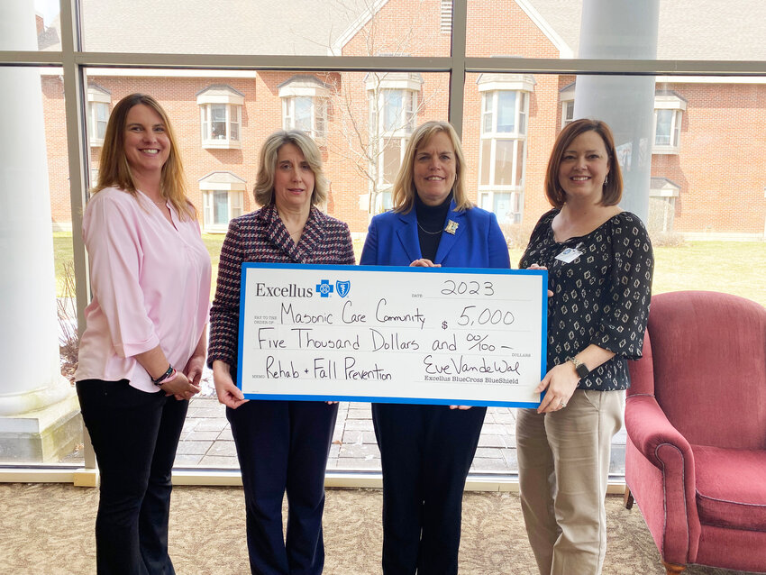 Officials with the Masonic Care Community and Excellus BlueCross BlueShield pause for a photo following an announcement of a $5,000 Excellus grant to the MCC to assist the agency&rsquo;s rehabilitation and fall prevention activities for residents of the Health Pavilion.