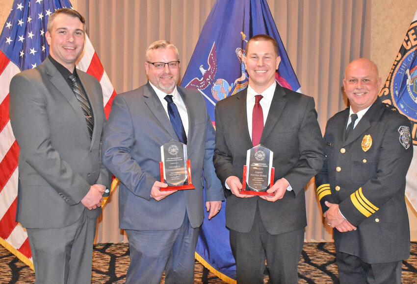 Two Oneida police officers were honored for their service at the annual awards ceremony Monday for the Central New York Association of Chiefs of Police. Inv. Christopher Bailey and Sgt. Matthew Mosack were awarded. From left: Oneida Police Chief Steven Lowell, Sgt. Mike Burges (who accepted the award on Bailey&rsquo;s behalf), Sgt. Mosack and Cicero Police Chief Steve Rotunno, president of the Association.
