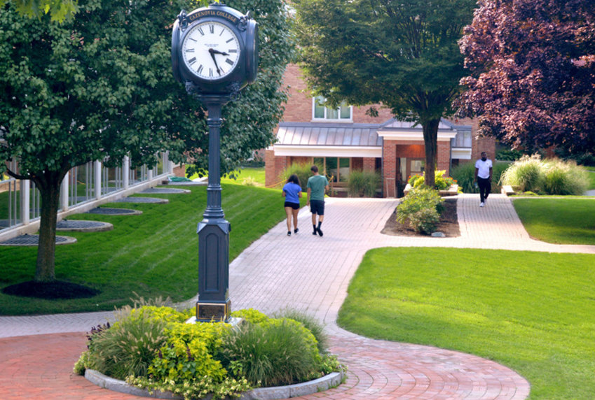 Students walk along the campus in this Cazenovia College file photo. The college will close permanently following the spring semester with the property recently going up for sale, according to officials.