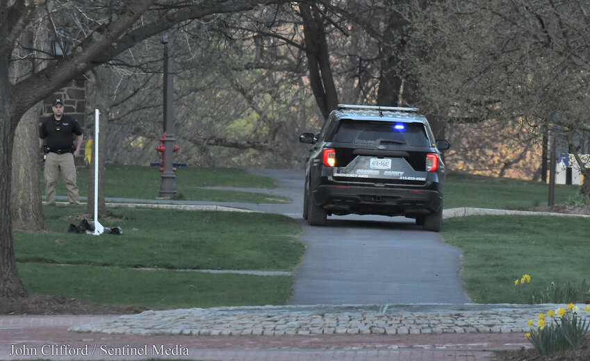 As a shelter-in-place order was issued for Hamilton College Sunday evening following a shooting threat received via social media, campus and area law enforcement responded to the threat.  Pictured, a Hamilton College Campus Police unit is stationed, looking east on a sidewalk along College Hill Road from the Wellin Museum of Art.