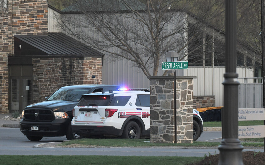 Pictured are Hamilton College Campus Police and an Oneida County Sheriff vehicle parked at an intersection at Hamilton College Sunday, April 16, 2023. This is looking east on a sidewalk along College Hill Road from the Wellin Museum of Art.