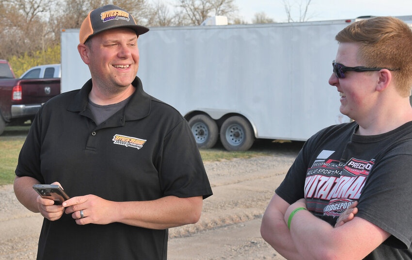 Utica-Rome Speedway promoter Brett Deyo, left, talks with sportsman driver Payton Talbot before practice last Friday night in Vernon. Deyo hopes for weather like last season, solid car counts each week, different winners and for the track to stay in great condition all season long.