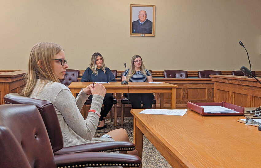 Teen attorneys await the start of Oneida Youth Court Wednesday night, in the Oneida City courthouse. From left: Olivia Peebles, 17, Nicole Chevez, 17, and Cassandra Goodison, 18. They are all students at Oneida High School.